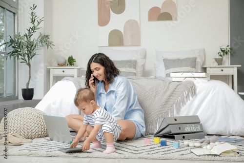 Working mother talking by m...
