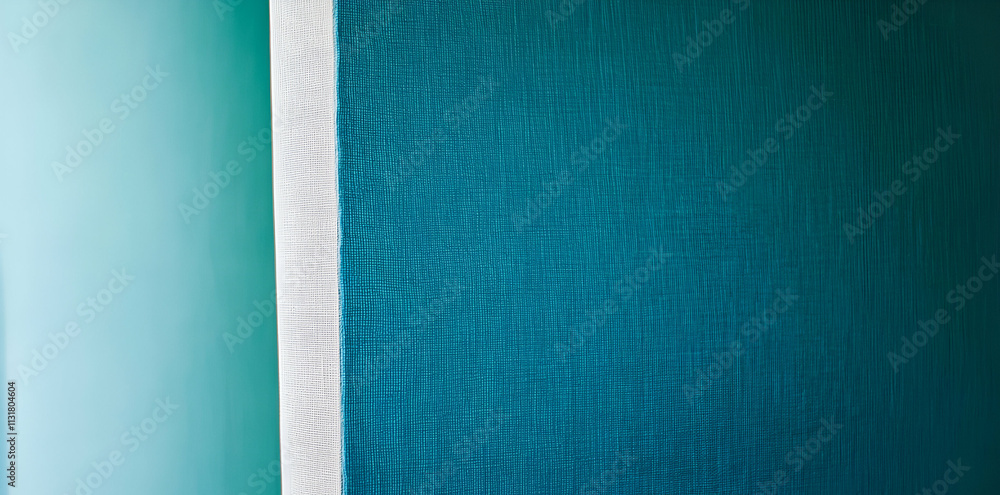 Fototapeta premium A minimalist image featuring a textured wall in shades of teal and a white edge.