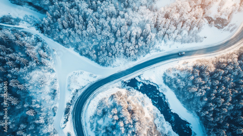 In winter, the road is covered with snow, and the trees on both sides are covered with frost. The road winds and stretches, the air is cold and fresh, the sky is gray and blue, and the scenery is quie photo