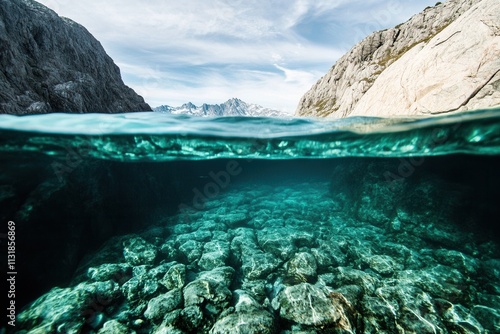 Underwater landscape with rocky formations and mountains.