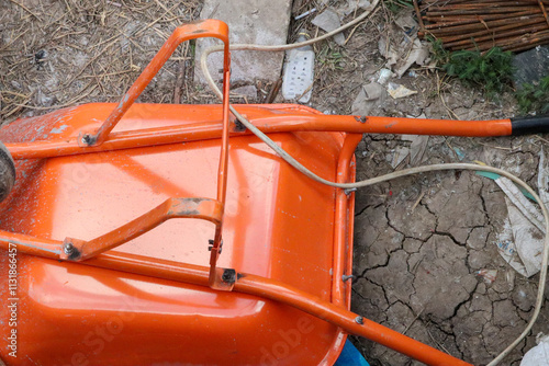 wheelbarrow with rope on the ground  photo