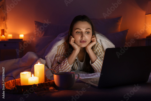 Young woman watching video ...