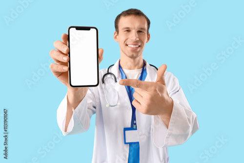 Male doctor pointing at bla...