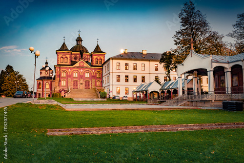 Adorable evening view of red brick Catholic Sanctuary of St. Michael the Archangel and Blessed Bronislaw Markiewicz in Piastowe - Michalice. Nice cityscape of Miejsce Piastowe town, Poland, Europe. photo