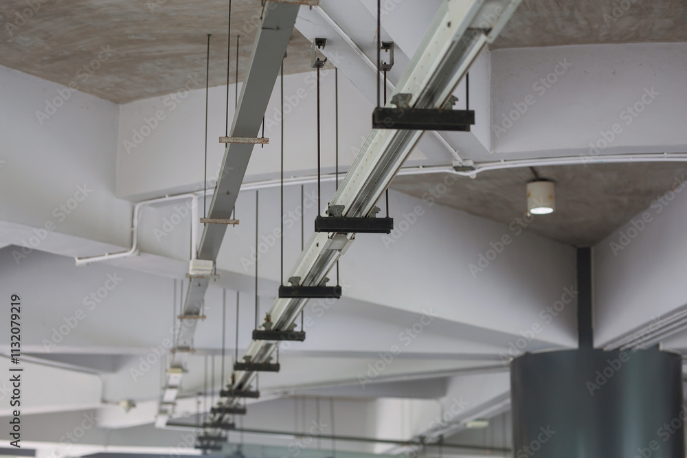 Naklejka premium Electrical system and CCTV cameras, fire pipes are installed under the building ceiling.