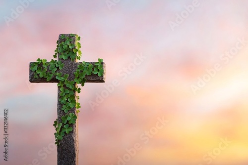 Mystical Celtic Cross Enveloped in Glowing Shamrock Vines at Sunset photo