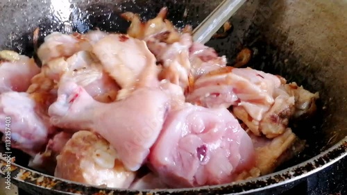 Cooking of organic chicken meat. Raw white meat mixed with spices to make delicious and famous recipe like peri-peri, butter chicken, fried, Pollo al acuyo, Karaage, Ayam goreng