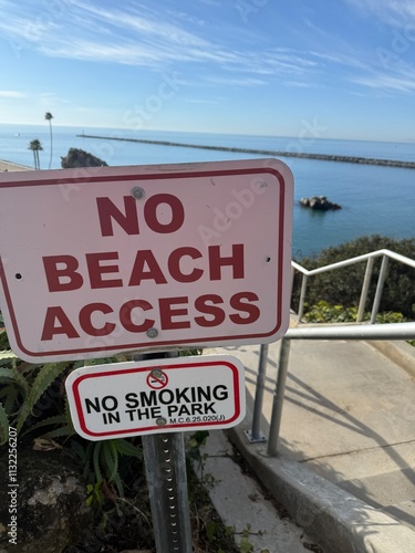 A sign that says no beach access 
