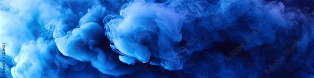 Fototapeta premium Abstract blue smoke background. Blue-colored fluid ink in water, fluid motion wallpaper.