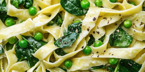 Close up of a delicious Italian pasta fettuccine featuring fresh spinach and peas, showcasing the vibrant colors and textures of this spinach pasta dish. Perfect for pasta lovers  photo