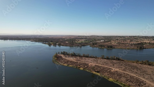 Wallpaper Mural Aerial view of a serene lake with clear blue sky. Torontodigital.ca