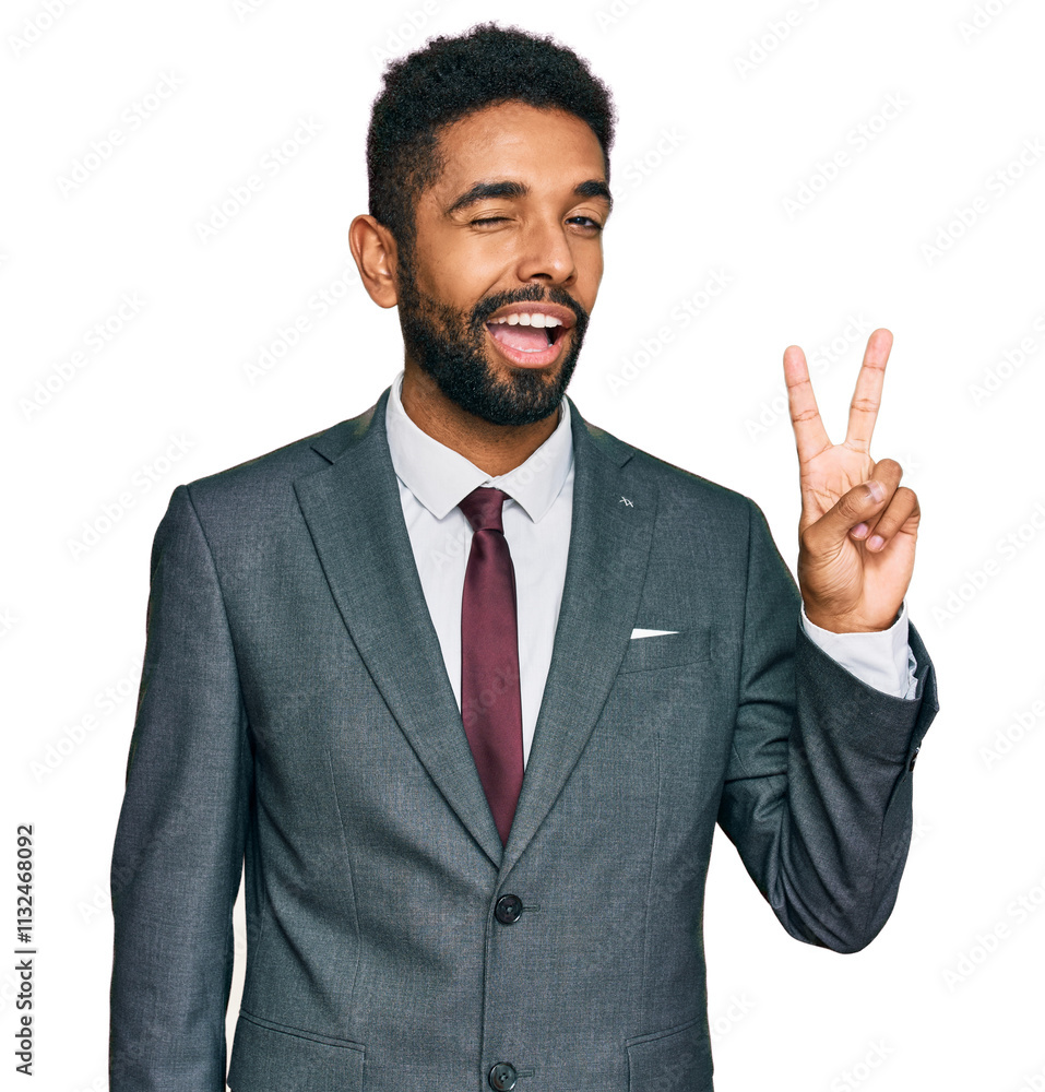 Φωτογραφία Young african american man wearing business clothes smiling with happy face winking at the camera doing victory sign