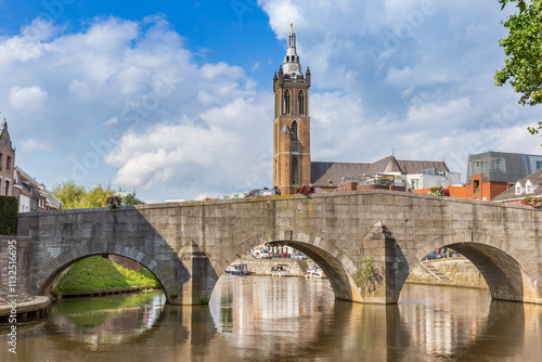 Church tower and historic bridge in Roermond, Netherlands photo