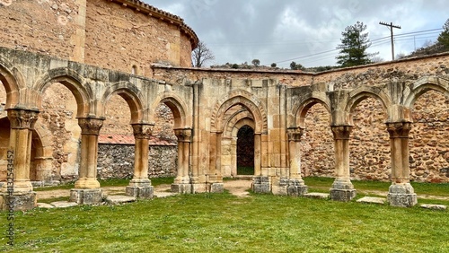 romanesque arches at san juan de duero, soria, spain photo