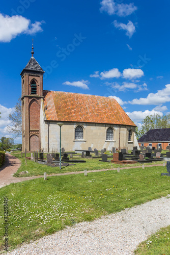 Historic church in the small village of Dorkwerd, Netherlands photo