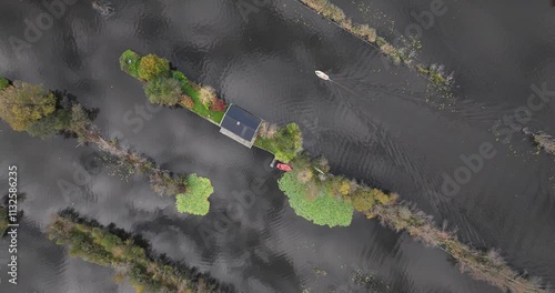 Small houses at the Loosdrechtse Plassen, Scheendijk, marina of Breukelen, The Netherlands, nature reserve with tow holes and legakkers photo