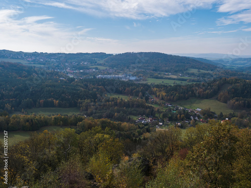 Wallpaper Mural Panoramic view from viewpoint Stredni vrch near Dolni Prysk, Ceska Kamenice. Autumn landscape with colorful forest, hills and blue cloudy sky in Luzicke hory Lusatian Mountains, Czech Republic. Torontodigital.ca