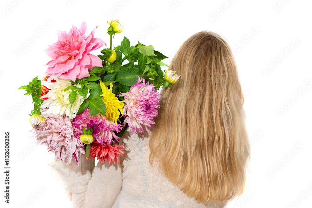 Naklejka premium An unrecognizable woman holds a bouquet of multi-colored dahlias in her hand behind her back, close-up, on a white background.