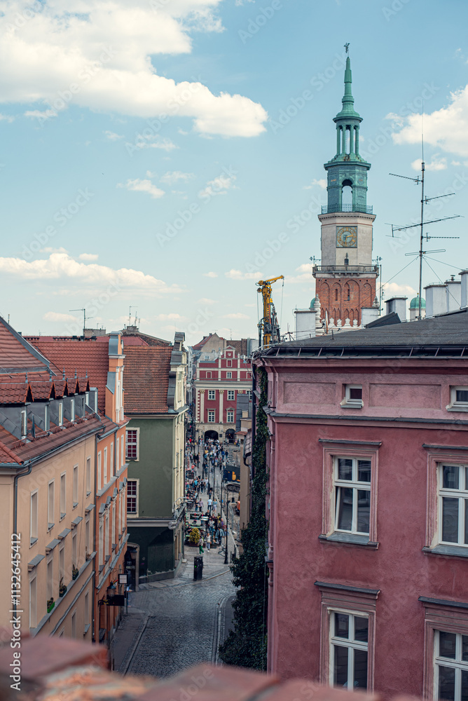 Obraz premium Narrow streets of Poznań leading to the Rynek square, showcasing the city's medieval charm
