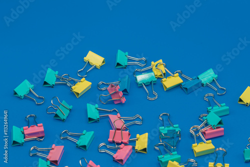 Clothespins scattered on a blue background.