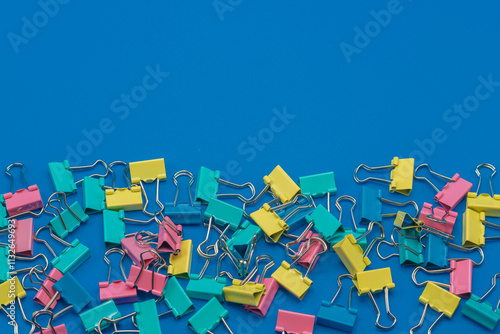 Clothespins scattered on a blue background.