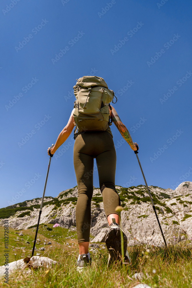 Female Traveler on Long Distance Hiking in Alps Mountains