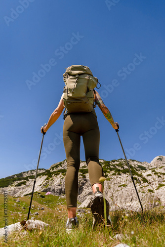 Female Traveler on Long Distance Hiking in Alps Mountains