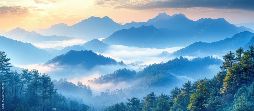 Obraz premium Misty mountain landscape at sunrise.
