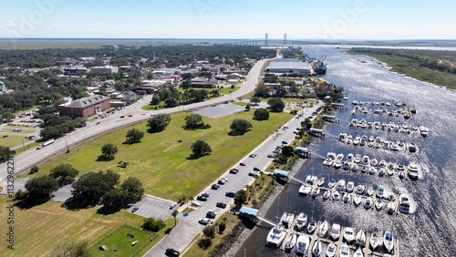 Southern coastal city Brunswick, Georgia historic golden isles vacation destination with marina, historic architecture outdoor parks under warm sunny sky and protected wetlands for wildlife