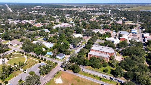 Southern coastal city Brunswick, Georgia historic golden isles vacation destination with marina, historic architecture outdoor parks under warm sunny sky and protected wetlands for wildlife