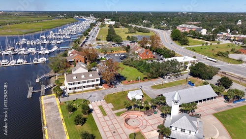Southern coastal city Brunswick, Georgia historic golden isles vacation destination with marina, historic architecture outdoor parks under warm sunny sky and protected wetlands for wildlife