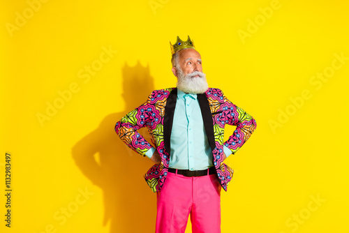 Photo portrait of nice senior male king crown look empty space wear trendy colorful pink fancy outfit isolated on yellow color background