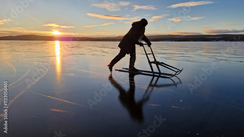 Eislaufen auf einem  einem zugefrorenen see in Schweden photo