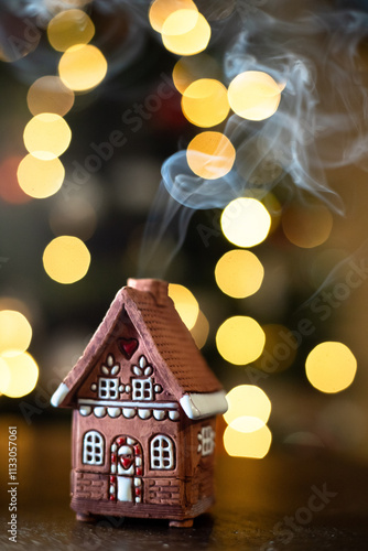 Christmas lights and gingerbread house. smoke from chimney
