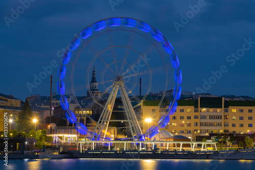 View of the working Ferris wheel on a late September evening, Cheboksary photo