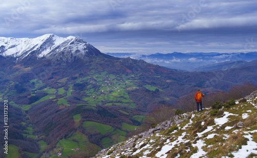 Aralar mountain range in Navarra. Hiker in the Araitz valley with Azkarate and Balerdi mountain, Navarra. photo