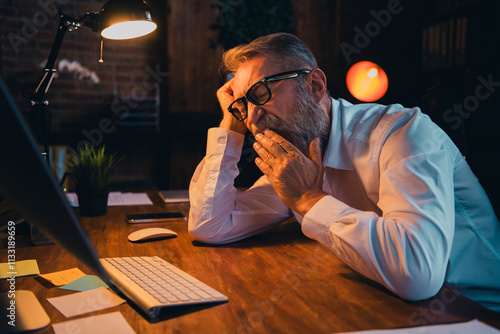 Photo of handsome mature mister yawning sleepy tired dressed white shirt formalwear evening lights comfortable startup office room interior photo