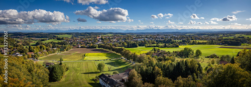 Panorama of a watch tower in Ebersberg, Germany, with alps in the background