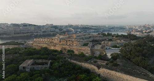 Aerial view of Fort Sant Elmo in Valletti, Malta. Cityscape and ancient architecture of the fortress on the shore of the Mediterranean Sea in touristic Europe. High quality 4k footage photo