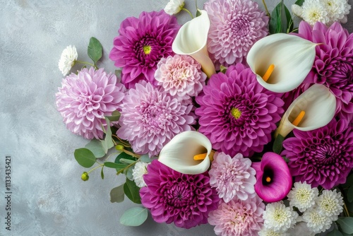 Colorful floral arrangement featuring purple and white blooms on a gray backg...