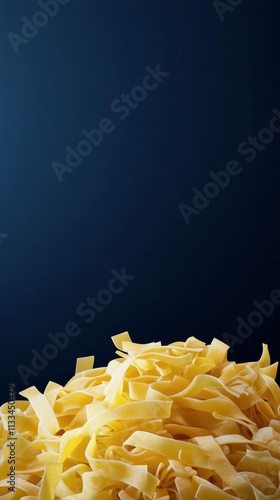 Freshly made pasta on a dark background highlighting its texture and color