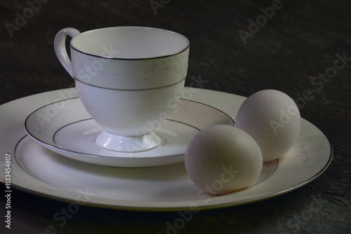 Still life: cup of tea and eggs.