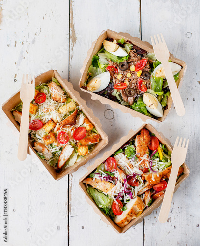 Healthy salads in plastic package for take away or food delivery.