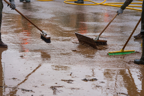 Foto Cleaning the streets with water and brushes, soldiers and firefighters, all unit