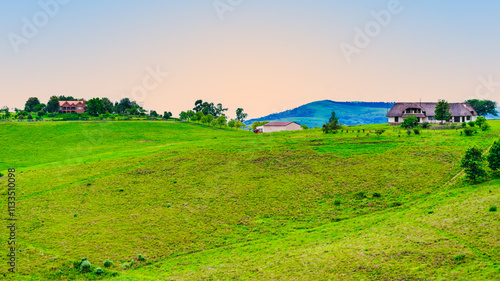 Obraz na płótnie Scenic and tranquil landscape of Drakensberg village houses on a hilltop during sunset, KwaZulu-Natal, South Africa w salonie