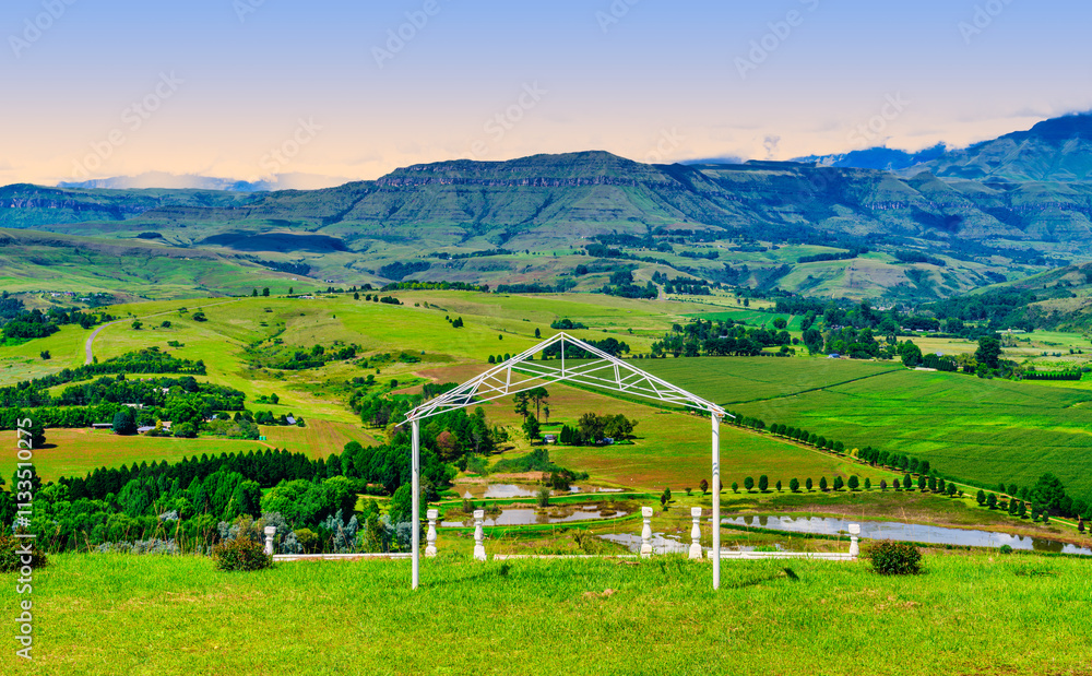 Drakensberg mountain and the valley below viewed from a chapel during sunset, KwaZulu-Natal, South Africa