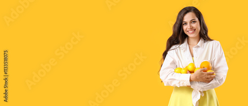 Pretty young woman holding ...