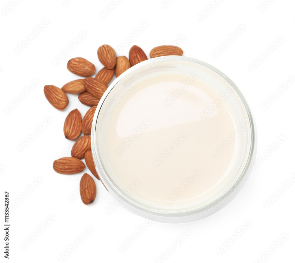 Glass of almond milk and nuts isolated on white, top view Glass of almond milk and nuts isolated on white, top view