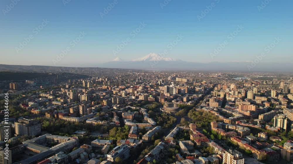 Rising up aerial shot of historical part of Yerevan and Mount Ararat on sunny april day. Armenia. Rising up aerial shot of historical part of Yerevan and Mount Ararat on sunny april day. Armenia.