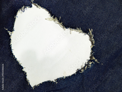 the heart forms an opening in the blue denim.